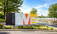 Project Identification signs at four different entry points. Internally illuminated with gridded white acrylic panels and painted metal panels that stand off to spell out “Ave” of the project logo. Photo credit: Vivian Marie Doering